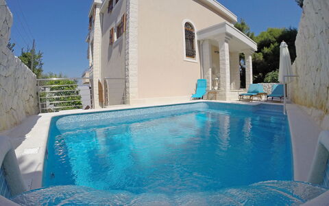 Villa Mustra: Water, Sky, Property, Building, Swimming Pool, Plant, Azure, Blue, Shade, Outdoor Furniture
