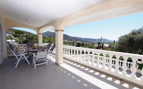 Bilbao: Sky, Furniture, Porch, Building, Chair, Shade, Plant, Tree, Outdoor Furniture, Fence