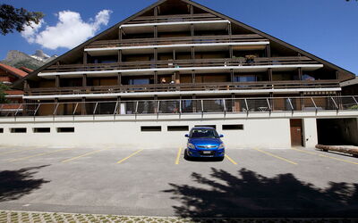 Ovronnaz 502: Cloud, Sky, Property, Car, Vehicle, Building, Window, House, Asphalt, Automotive Design