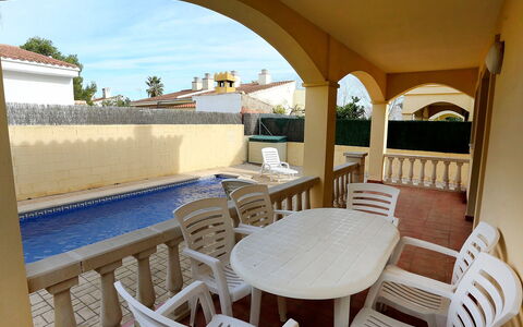 Tatiana: Table, Furniture, Property, Plant, Chair, Water, Building, Shade, Sky, Architecture