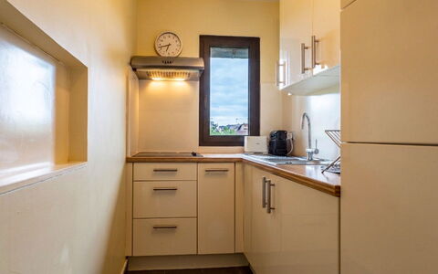 Les Manoirs: Kitchen Appliance, Countertop, Interior Design, Wood, Flooring, Cabinetry, Kitchen, Major Appliance, Floor, Room