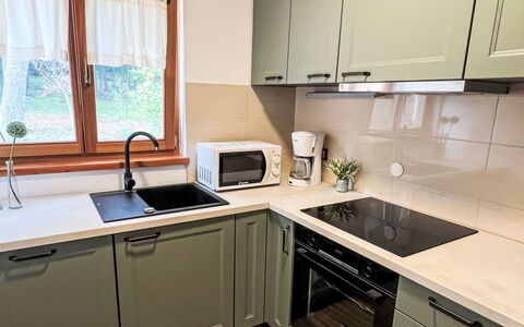 Verudela: Wood, Kitchen, Kitchen Appliance, Cabinetry, Major Appliance, Furniture, Flooring, Interior Design, Countertop, Drawer