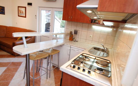 Ratimir: Countertop, Cabinetry, Kitchen Appliance, Gas Stove, Kitchen Stove, Kitchen, Sink, Wood, Picture Frame, Cooktop