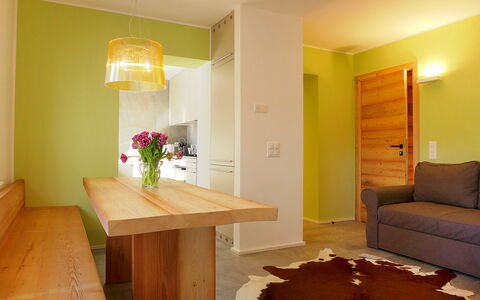 Chesa la Soliva: Flower, Furniture, Table, Wood, Building, Plant, Orange, Shade, Interior Design, Floor