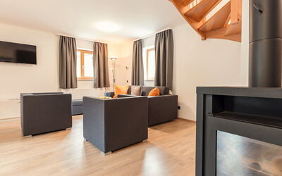 Chalet Montafon 130.2: Furniture, Wood, Living Room, Building, Lighting, Orange, Hearth, Interior Design, Flooring, Hall