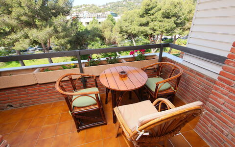 Rambla de Tossa: Furniture, Plant, Building, Tree, Outdoor Furniture, Wood, Interior Design, Sky, Chair, Flooring