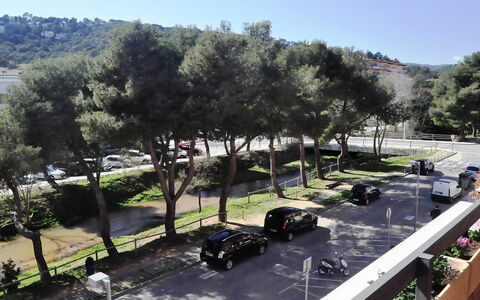 Rambla de Tossa: Sky, Plant, Property, Car, Tree, Vehicle, Shade, Land Lot, Urban Design, Landscape
