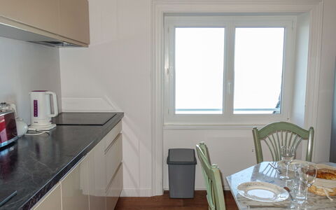 Les Nielles: Cabinetry, Property, Furniture, Window, Countertop, Table, Tableware, Building, Kitchen Stove, Chair