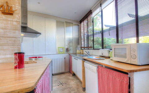 Villa Thiers: Cabinetry, Countertop, Furniture, Window, Kitchen, Kitchen Appliance, Wood, Home Appliance, Lighting, Kitchen Stove