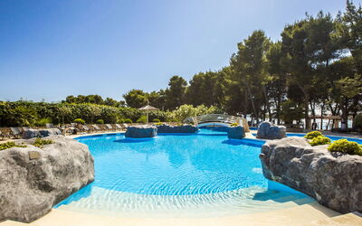 Vodice 200: Water, Sky, Water Resources, Swimming Pool, Tree, Natural Landscape, Plant, Body Of Water, Grass, Aqua