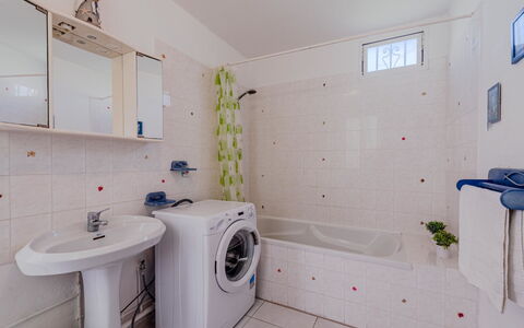 Nautica: Mirror, Plumbing Fixture, Property, Tap, Building, Blue, Purple, Laundry Room, Bathroom, Window