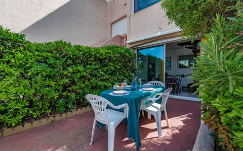 Nautica: Plant, Property, Furniture, Table, Building, Vegetation, Outdoor Furniture, Outdoor Table, Shade, Urban Design