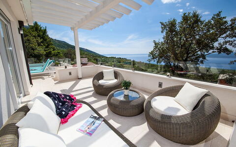 Prestige: Sky, Cloud, Furniture, Building, Couch, Azure, Comfort, Outdoor Furniture, Tree, Seaside Resort