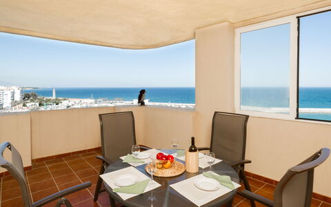 Puerto Paraíso: Sky, Water, Table, Property, Furniture, Building, Chair, Azure, Architecture, Interior Design