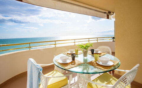 Front Beach: Water, Furniture, Sky, Property, Table, Chair, Plant, Azure, Cloud, Building