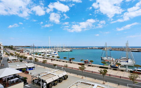 Cambrils Port: Cloud, Water, Sky, Vehicle, Boat, Watercraft, Dock, Building, Lake, City