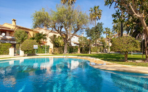 El Arenal: Water, Plant, Sky, Building, Swimming Pool, Tree, Blue, Natural Landscape, Arecales, Landscape