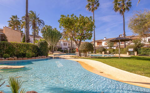 El Arenal: Water, Plant, Sky, Cloud, Building, Azure, Tree, Arecales, Swimming Pool, Leisure