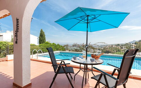 Villa Jilian: Water, Sky, Table, Furniture, Property, Cloud, Building, Azure, Shade, Chair