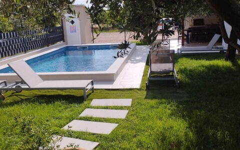Finida: Swimming Pool, Garden, Composite Material, Outdoor Furniture, Leisure, Backyard, Landscaping, Shade, Yard