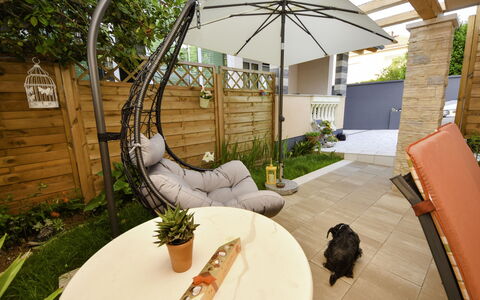 Katarina: Plant, Property, Building, Wood, Interior Design, Flowerpot, Shade, Outdoor Furniture, Couch, Tree