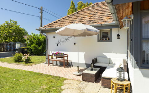 Sunny: Building, House, Roof, Home, Residential Area, Furniture, Cottage, Outdoor Furniture, Garden, Shade