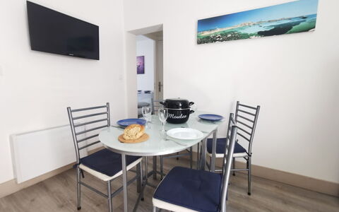 La Licorne: Table, Furniture, Property, Building, Chair, Interior Design, Television, Wood, Floor, Wall