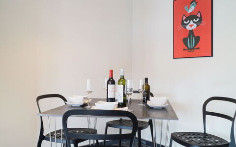 Plaza de Las Flores: Table, Bottle, Furniture, Property, Tableware, Building, Drinkware, Chair, Lighting, Interior Design