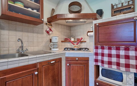 Pula 129: Room, Property, Cabinetry, Kitchen, Furniture, Countertop, Tile, Interior Design, Building, Architecture