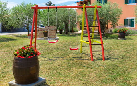 Pula 129: Public Space, Playground, Grass, Tree, Outdoor Play Equipment, Land Lot, Recreation, Backyard, Architecture, Plant