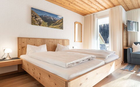 Atlantis Apartments by Mein Samnaun – Mo: Wood, Home, Bedroom, Mountain Range, Bed, Hardwood, Bedding, Bed Sheet, Glacial Landform, Bed Frame
