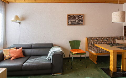 Atlantis Apartments by Mein Samnaun – Mo: Table, Sky, Furniture, Plant, Flowerpot, Cloud, Window, Flower, Houseplant, Mountain