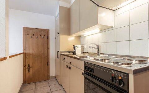 Atlantis Apartments by Mein Samnaun – Mo: Wood, Flooring, Interior Design, Ceiling, Kitchen, Major Appliance, Cabinetry, Floor, Room, Countertop