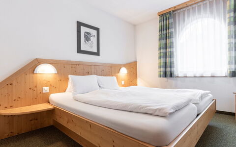 Atlantis Apartments by Mein Samnaun – Mo: Bedroom, Bed, Bed Frame, Hotel, Bedding, Hardwood, Bed Sheet, Mattress, Mattress Pad