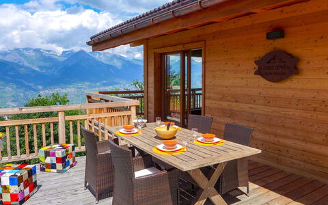 D'Arby: Cloud, Building, Table, Sky, Furniture, Property, Window, Wood, Shade, Interior Design