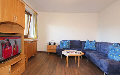 Aschau im Zillertal 330: Furniture, Cabinetry, Comfort, Couch, Wood, Interior Design, Flooring, Studio Couch, Floor, Living Room