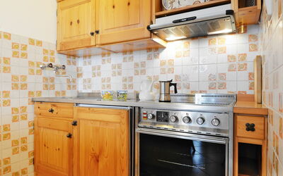 Apt 39 590.5: Cabinetry, Building, Countertop, Property, Picture Frame, Kitchen Appliance, Kitchen, Kitchen Stove, Home Appliance, Cooktop