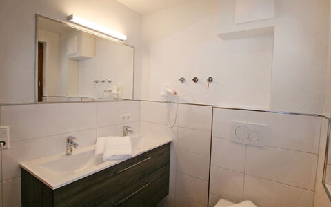 Happy: Mirror, Tap, Sink, Bathroom Sink, Bathroom Cabinet, Plumbing Fixture, Cabinetry, Bathroom, Floor, Wood