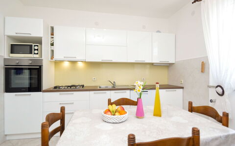 More: Cabinetry, Furniture, Countertop, Property, Table, Chair, Wood, Kitchen, Kitchen Appliance, Kitchen Stove