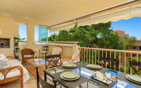 Calahonda Royale: Table, Furniture, Property, Plant, Chair, Wood, Building, Shade, Interior Design, Sky