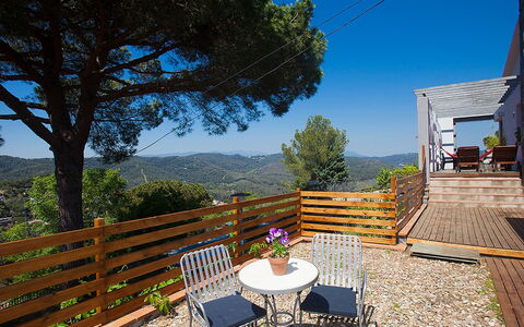 Ginesteres: Sky, Building, Plant, Property, Furniture, Table, Tree, Shade, Chair, Outdoor Furniture