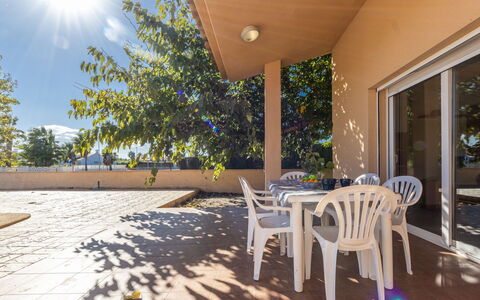 Alex: Furniture, Plant, Building, Table, Light, Sky, Chair, Shade, Tree, Wood