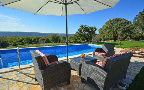 Stancija Negri: Water, Property, Sky, Furniture, Umbrella, Plant, Building, Azure, Table, Shade