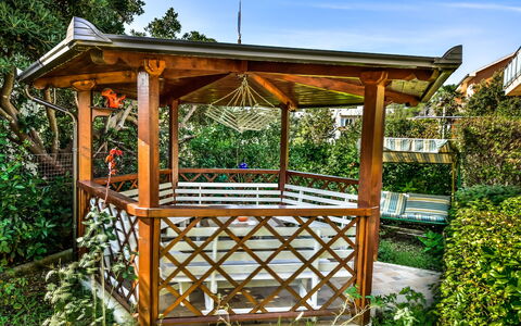 Lidija: Plant, Sky, Wood, Rectangle, Shade, Tree, Outdoor Structure, Grass, Gazebo, Leisure