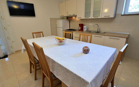 Bili Dvori: Table, Furniture, Cabinetry, Wood, Chair, Lighting, Kitchen, Interior Design, Countertop, Kitchen & Dining Room Table
