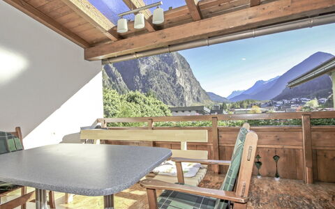 Dialer: Property, Table, Mountain, Building, Plant, Sky, Wood, Shade, Interior Design, Lighting