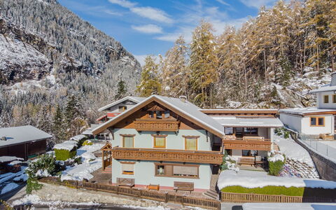 Dialer: Sky, Cloud, Building, Daytime, Property, Window, Snow, Mountain, Nature, Plant