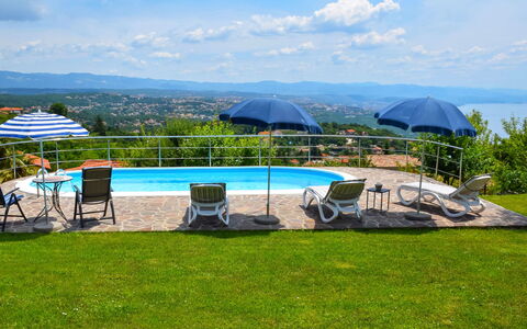 Lea: Cloud, Sky, Plant, Property, Water, Umbrella, Azure, Outdoor Furniture, Land Lot, Shade
