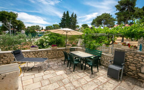 Brač Sutivan 111: Cloud, Table, Sky, Plant, Furniture, Property, Flowerpot, Outdoor Table, Tree, Shade